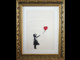 Rubano stampa 'Ragazza con Palloncino' di Banksy, incriminate 2 persone